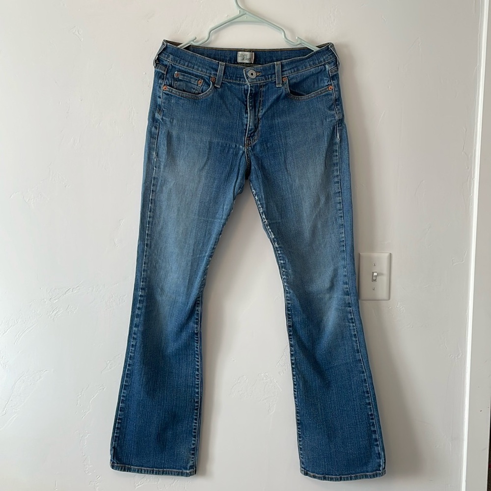Levi jeans, 10 long, worn with holes